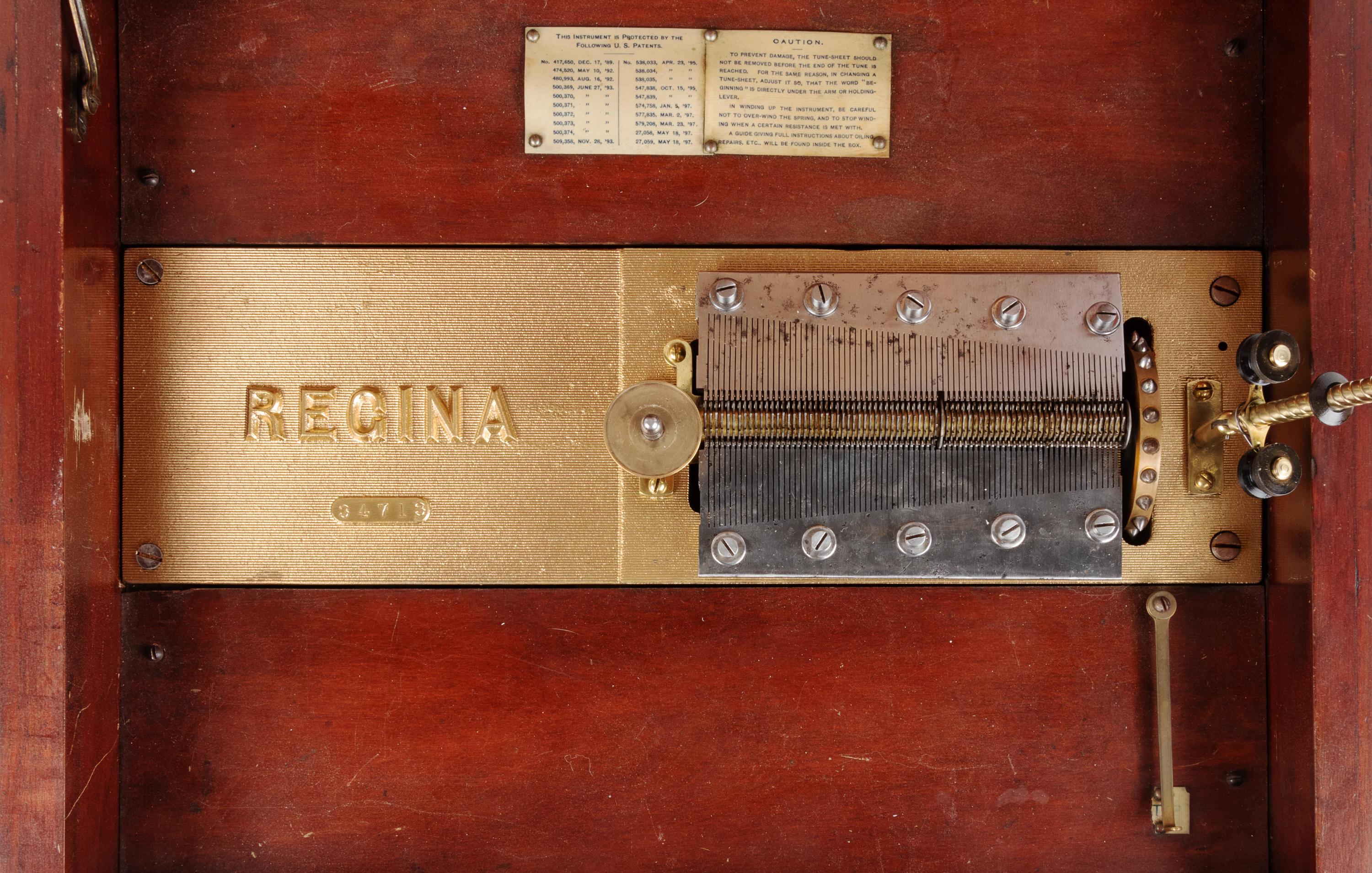 A Regina 15 1/2-Inch Double-Comb Disk Oak Music Box