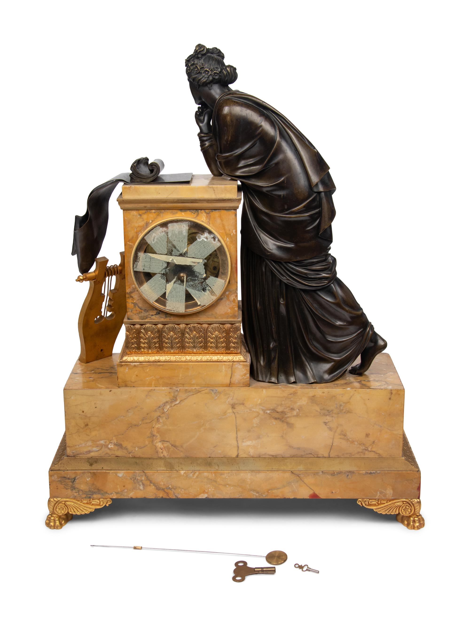 A Large Empire Gilt and Patinated Bronze and Marble Figural Clock
