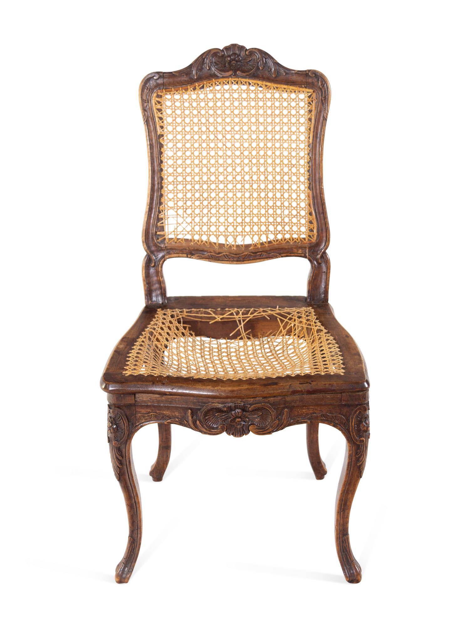 A Pair of Louis XV Carved Walnut Side Chairs