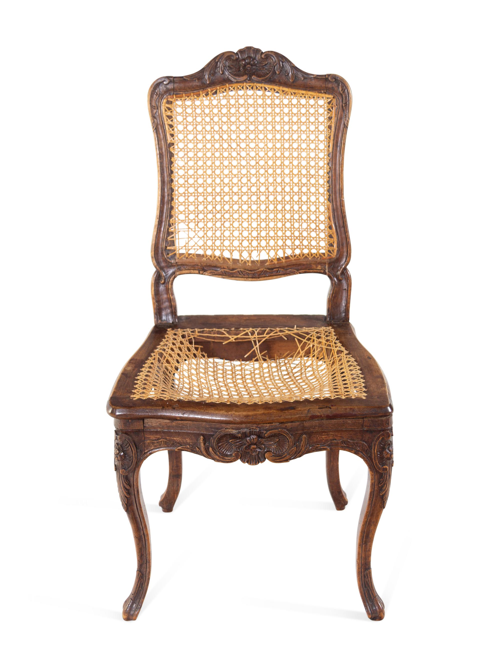 A Pair of Louis XV Carved Walnut Side Chairs