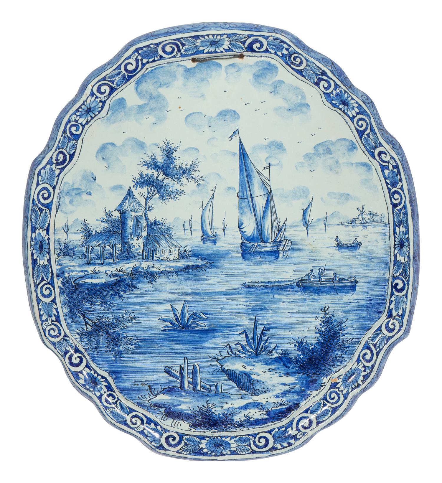 A Delft Ceramic Oval Cartouche Form Landscape Plaque
