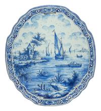 A Delft Ceramic Oval Cartouche Form Landscape Plaque