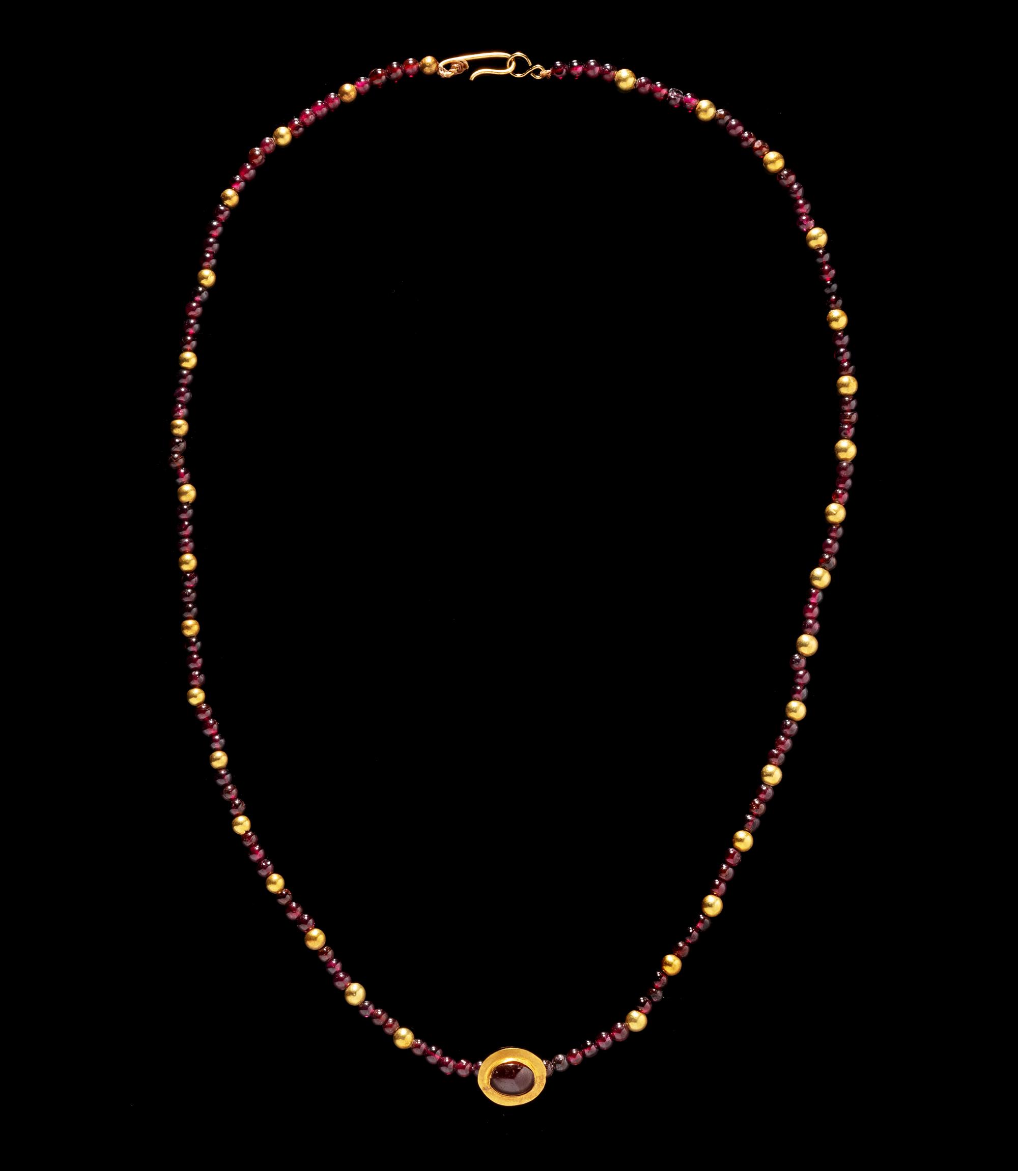 A Roman Gold and Garnet Bead Necklace