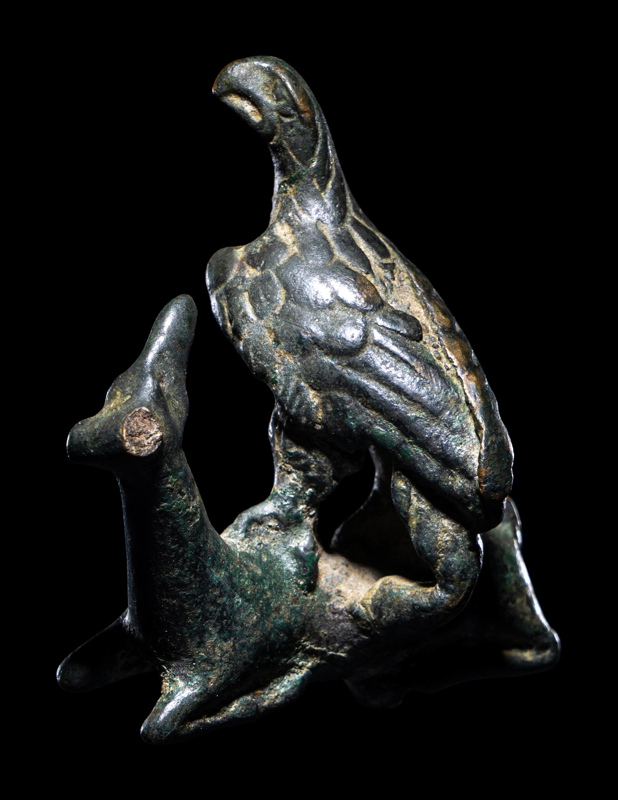 A Roman Bronze Eagle Grasping a Deer