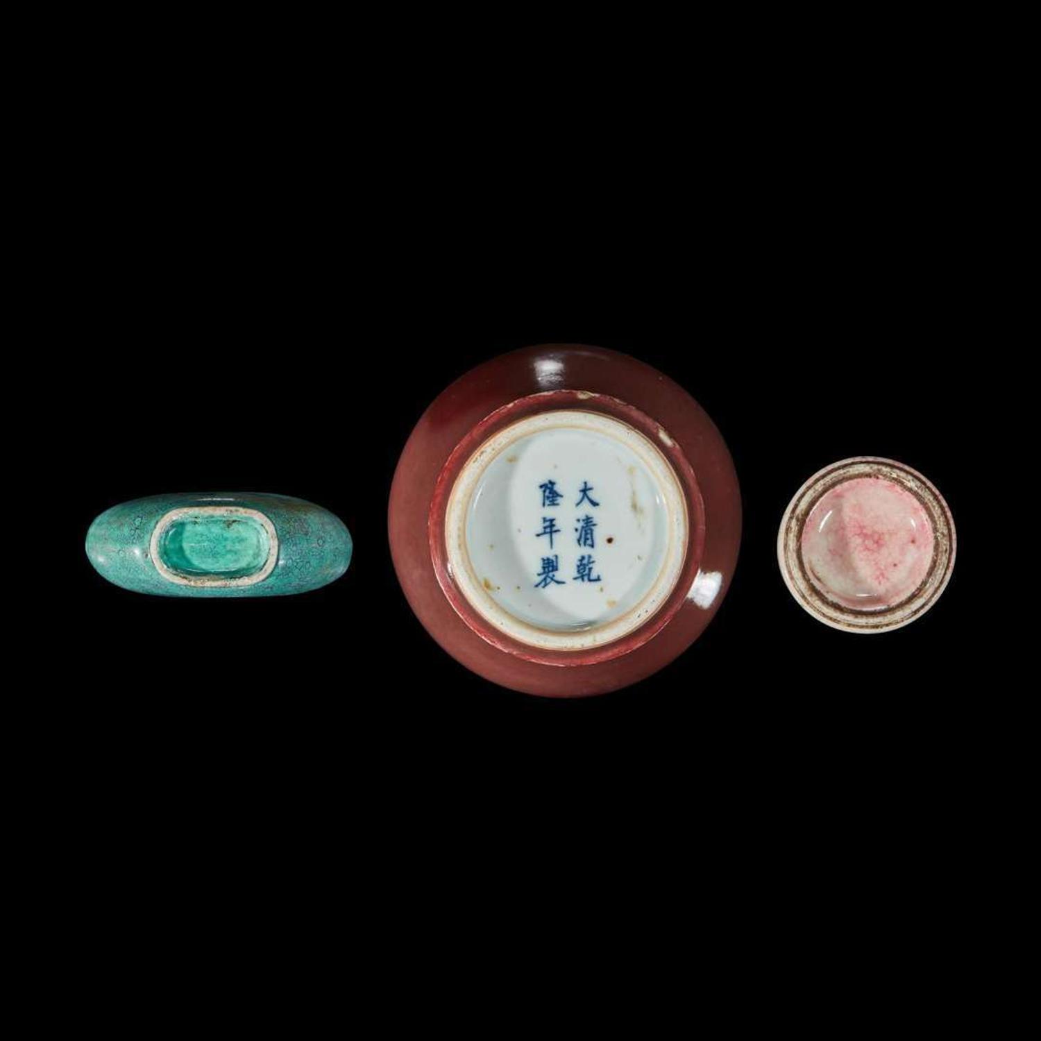 A Chinese red-glazed small meiping and two porcelain snuff bottles