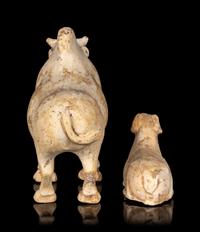 A Chinese Painted Pottery Figures of an Ox and a Ram