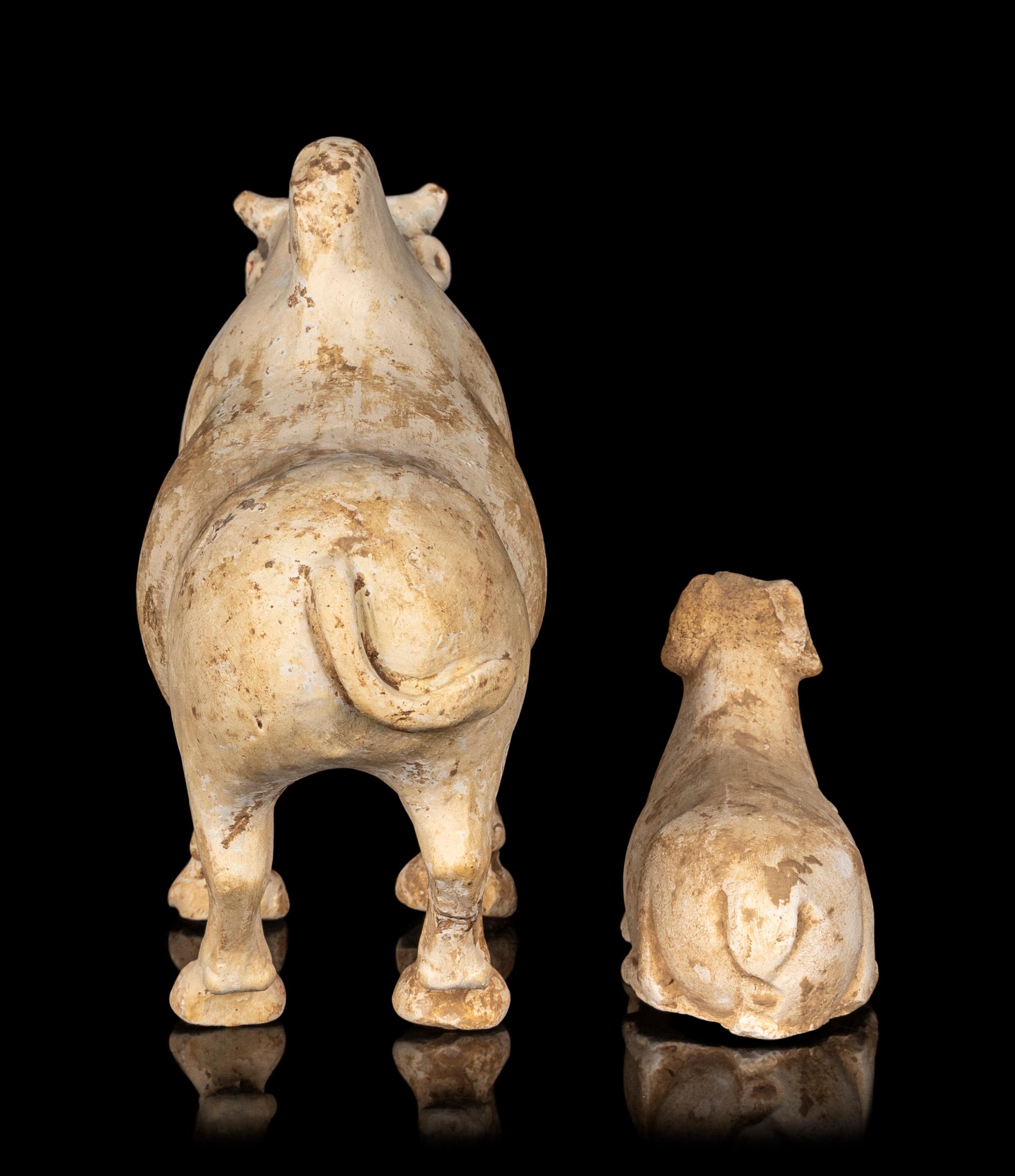 A Chinese Painted Pottery Figures of an Ox and a Ram