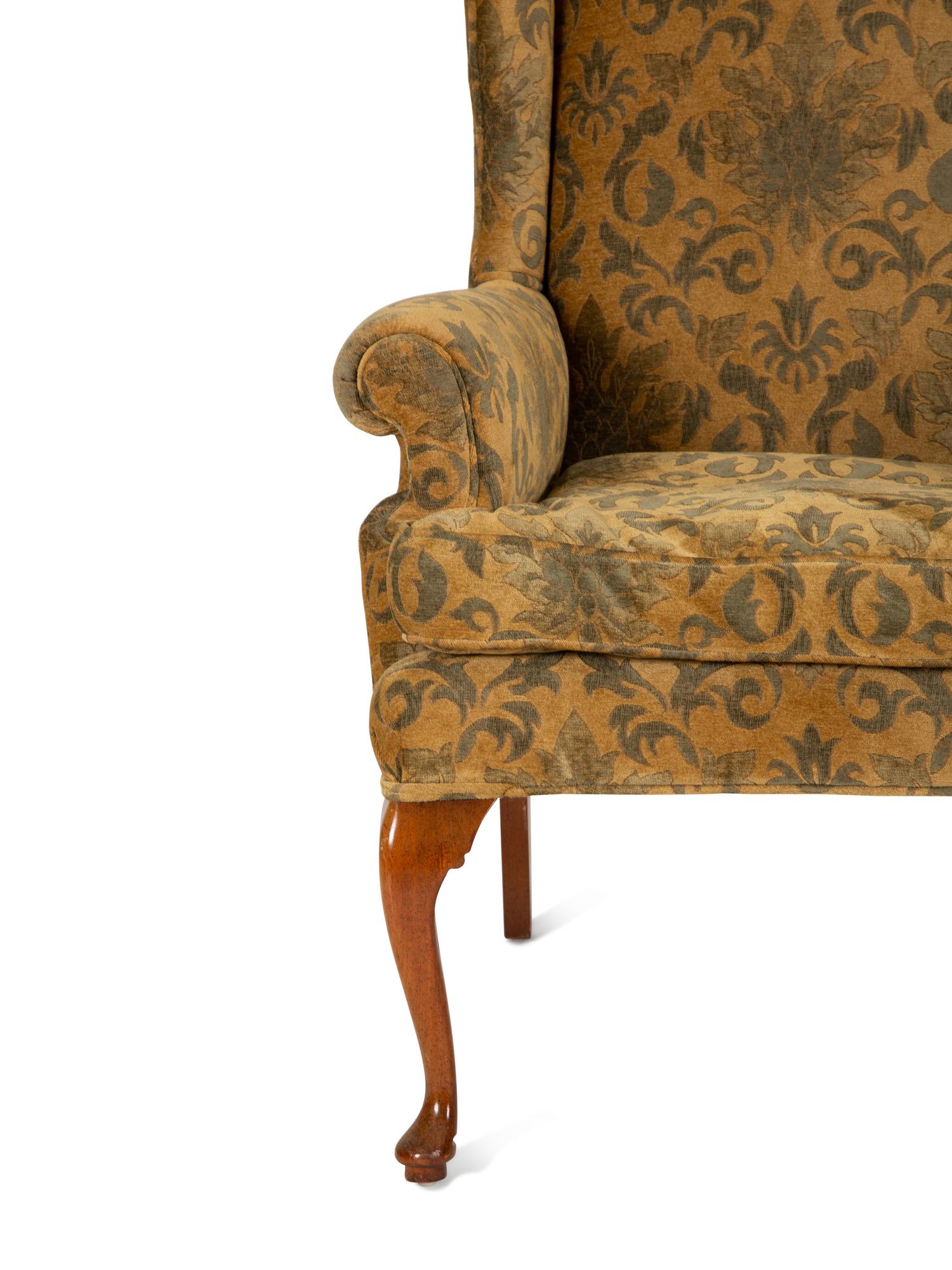 A Queen Anne Style Upholstered Wing Back Armchair — 20th Century
