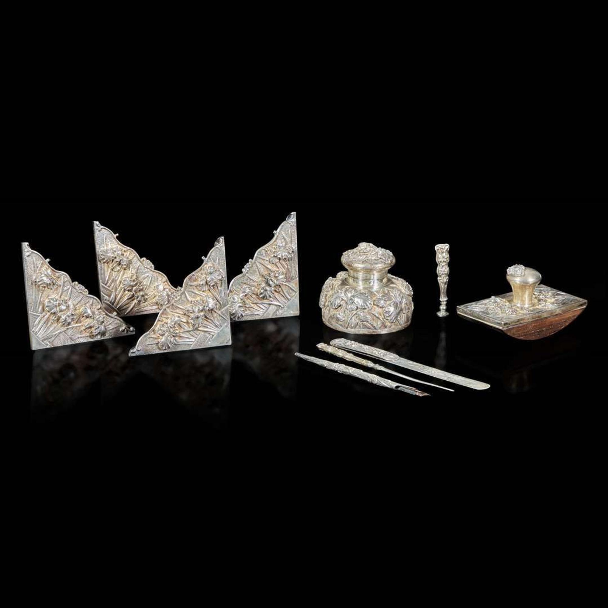 An eight-piece Chinese silver desk set with two added pieces 银质器具一组八件及两附件