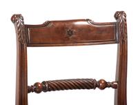 Seven Regency Style Brass Inlaid Mahogany Chairs