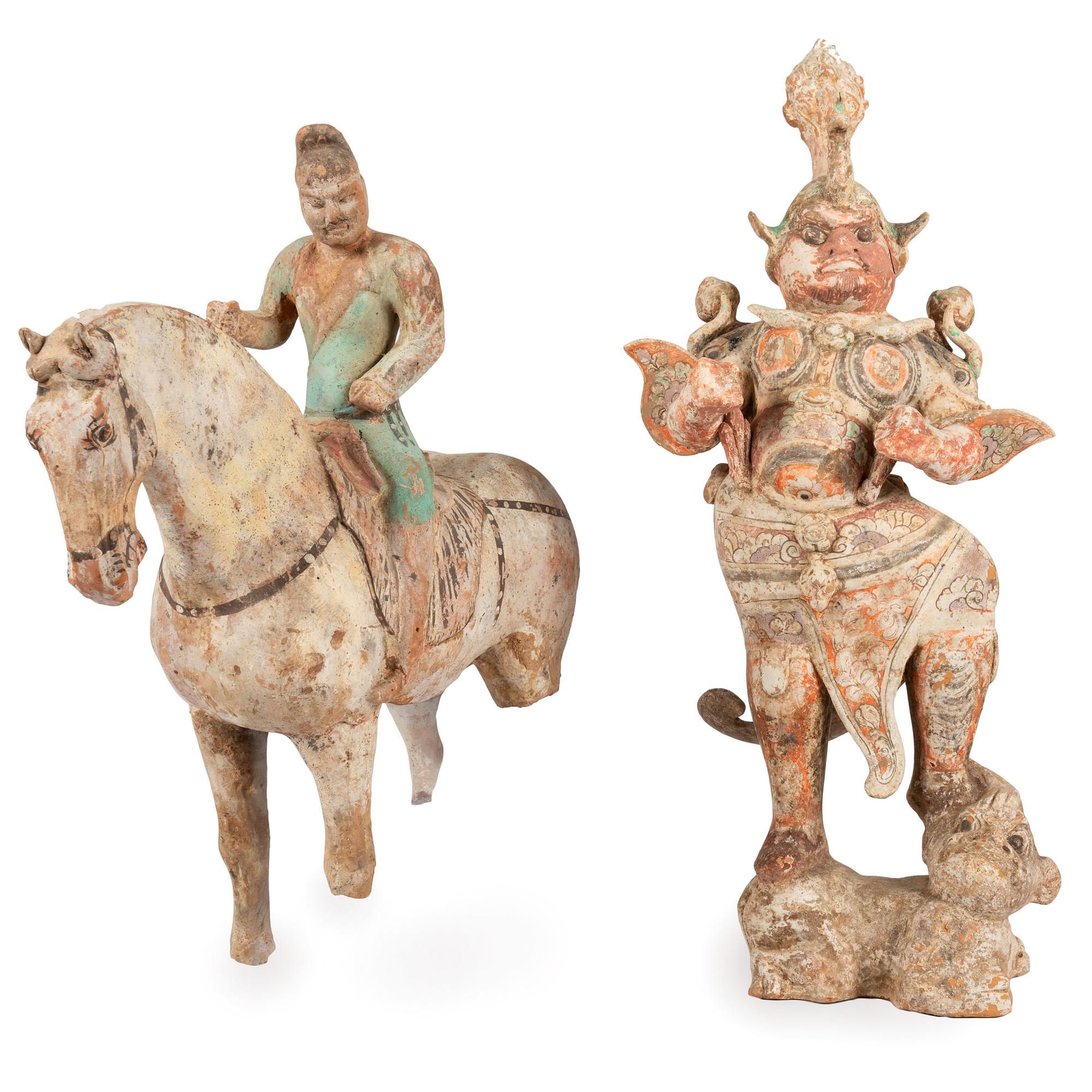 A Chinese Terracotta Equestrian Figure and a Standing Warrior with Lion