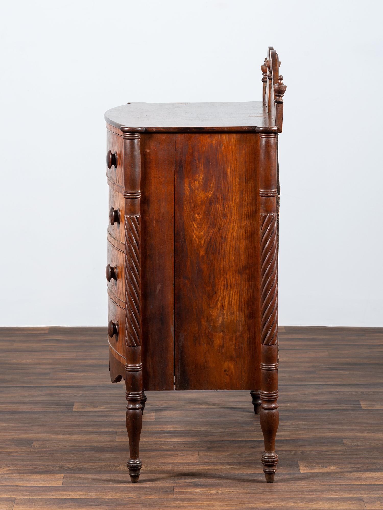 A Late Federal Spiral-Twist Carved and Figured Mahogany Chest of Drawers