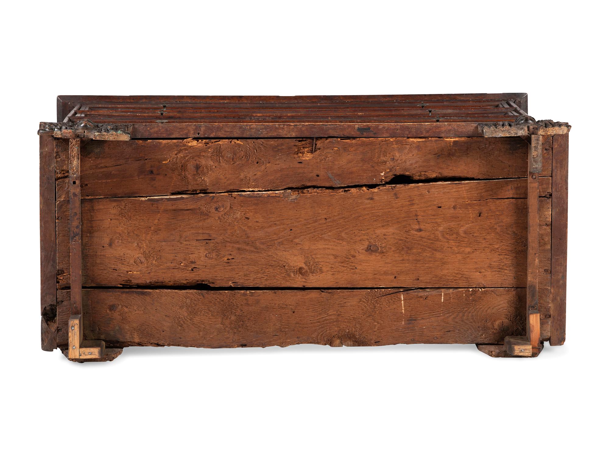 A Baroque Highly Carved Walnut Commode