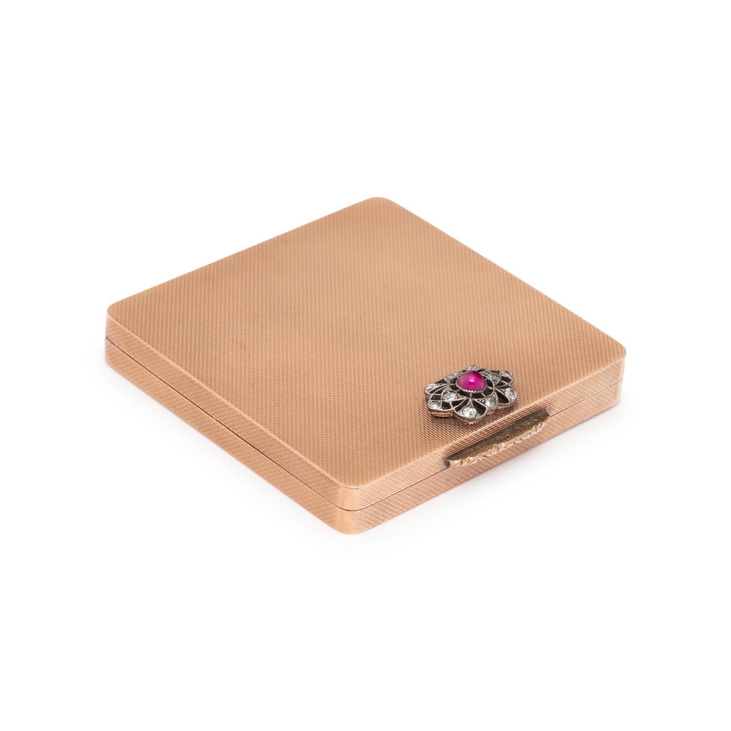 LOW KARAT GOLD, SYNTHETIC RUBY, AND DIAMOND COMPACT