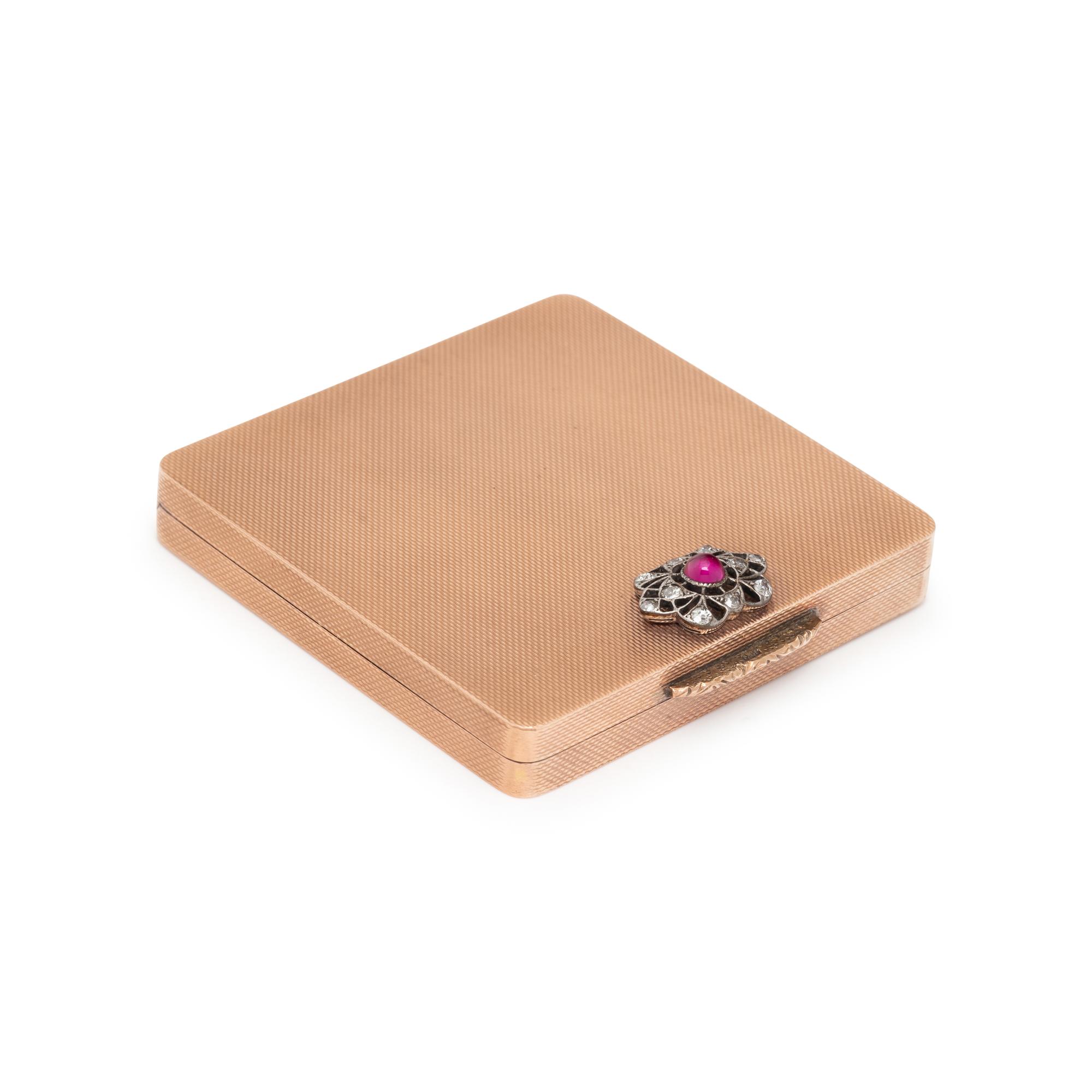 LOW KARAT GOLD, SYNTHETIC RUBY, AND DIAMOND COMPACT