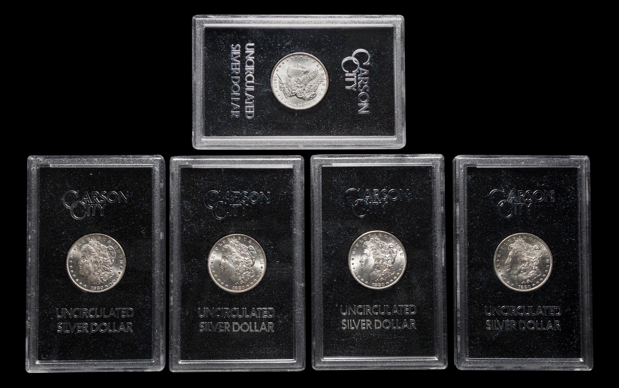 A Group of Five 1880-CC GSA: Morgan $1 Coins