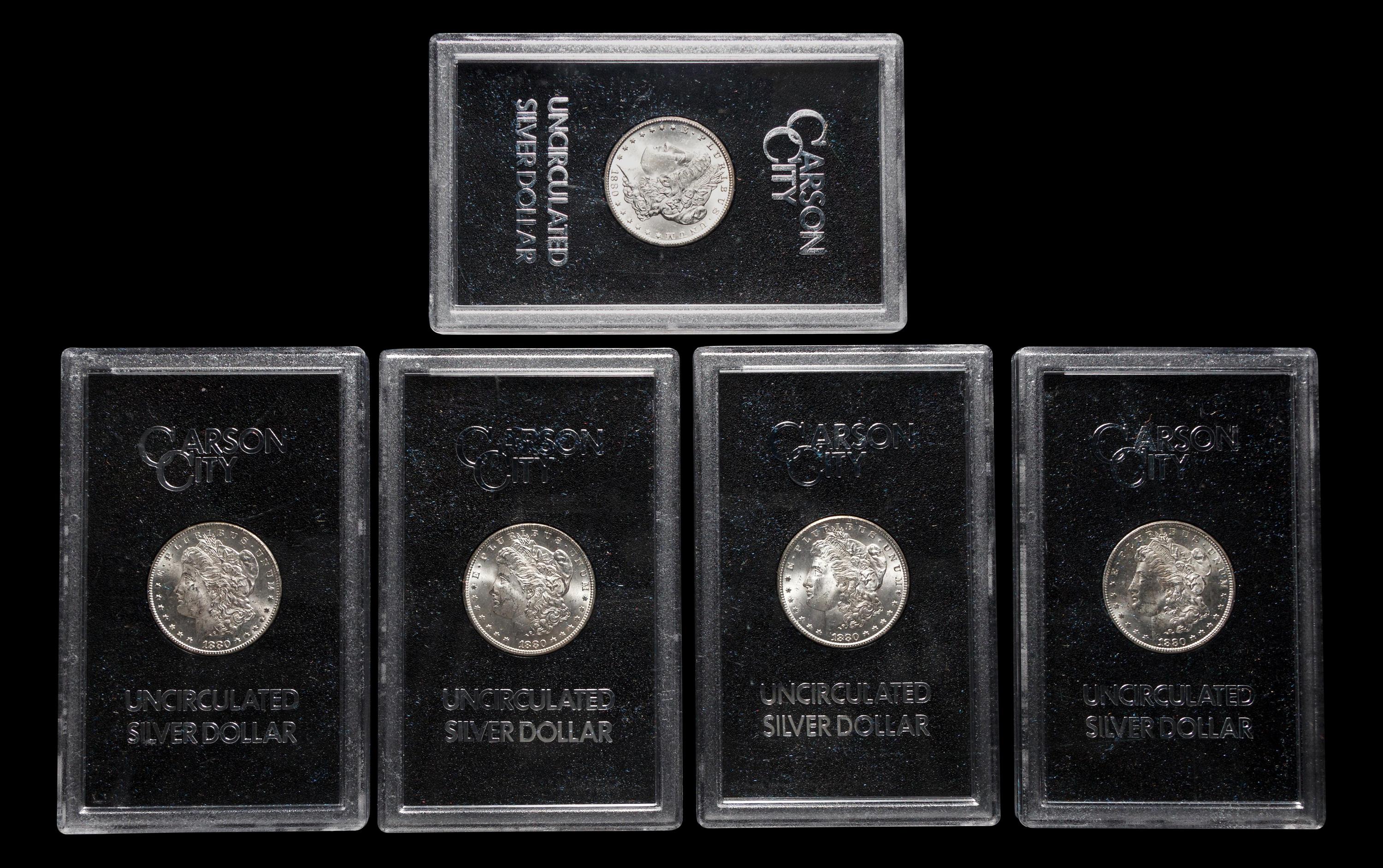 A Group of Five 1880-CC GSA: Morgan $1 Coins