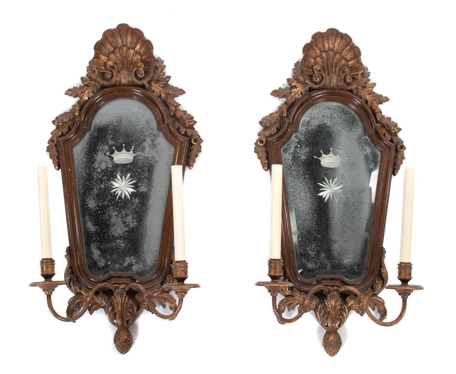 A Pair of Italian Rococo Style Parcel-Gilt Walnut Sconces