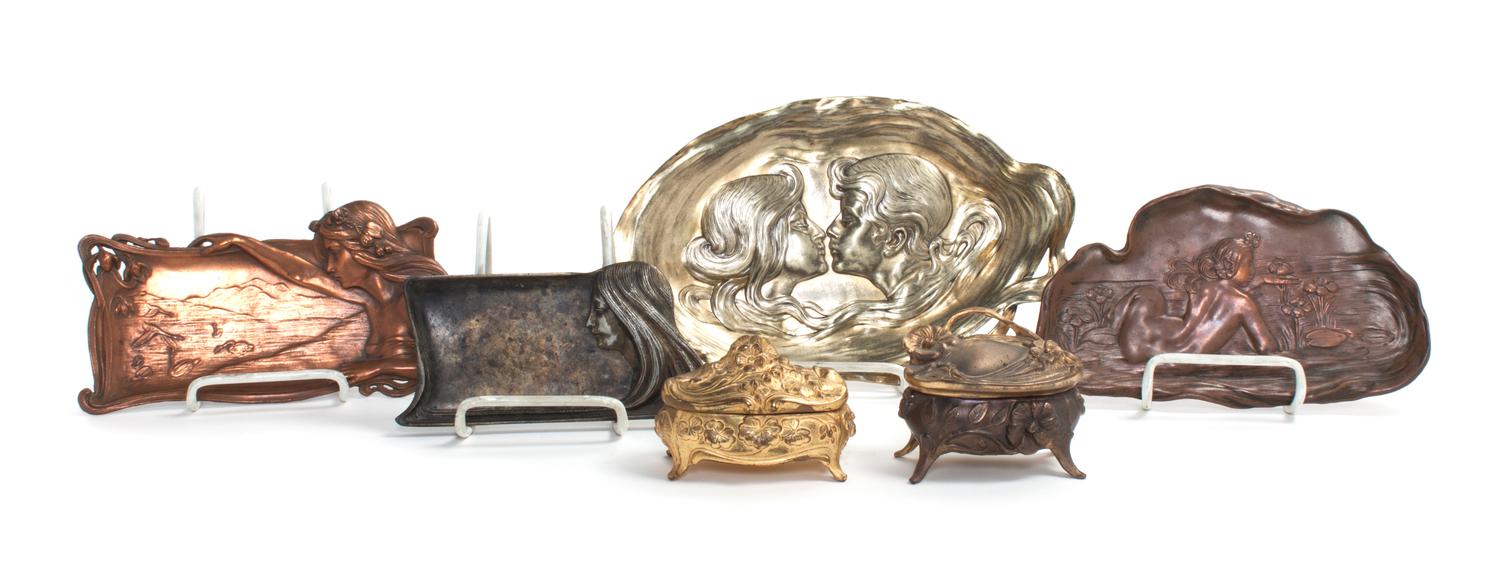 A Collection of Art Nouveau Metal Trays Length of longest 11 inches.