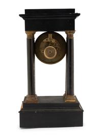 A Charles X Ebonized Mantel Clock