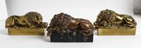 A Pair of Brass Lions, After Canova Length 7 1/2 inches.