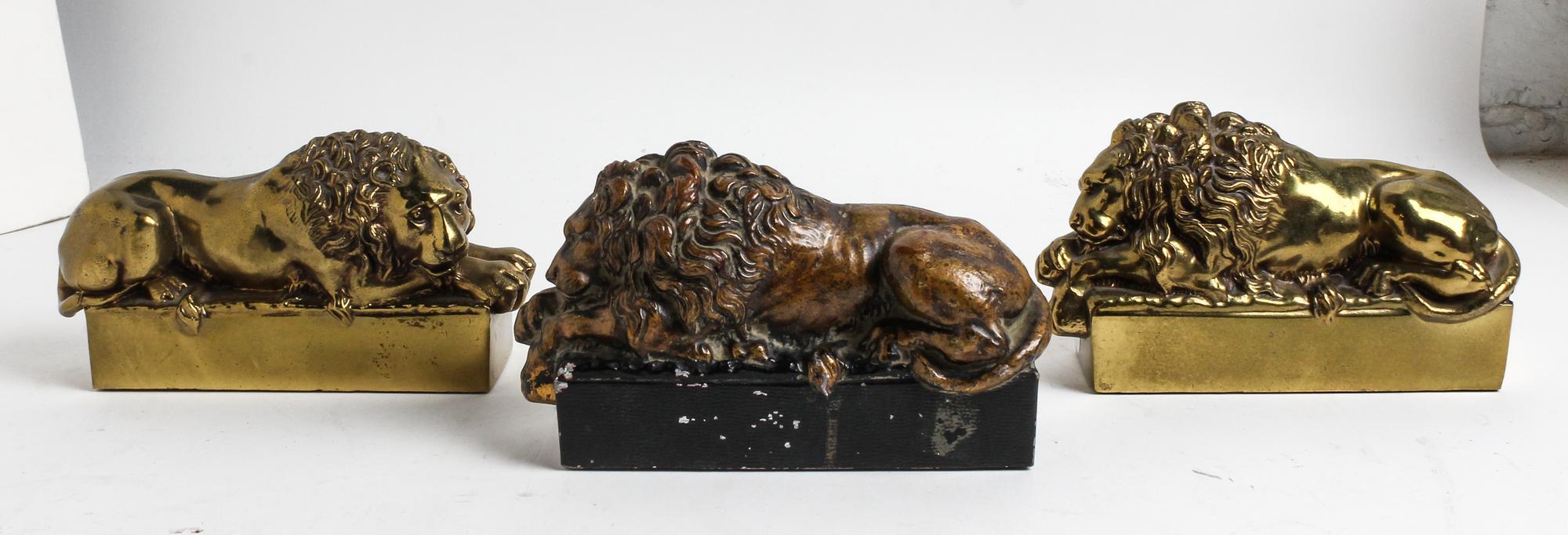 A Pair of Brass Lions, After Canova Length 7 1/2 inches.