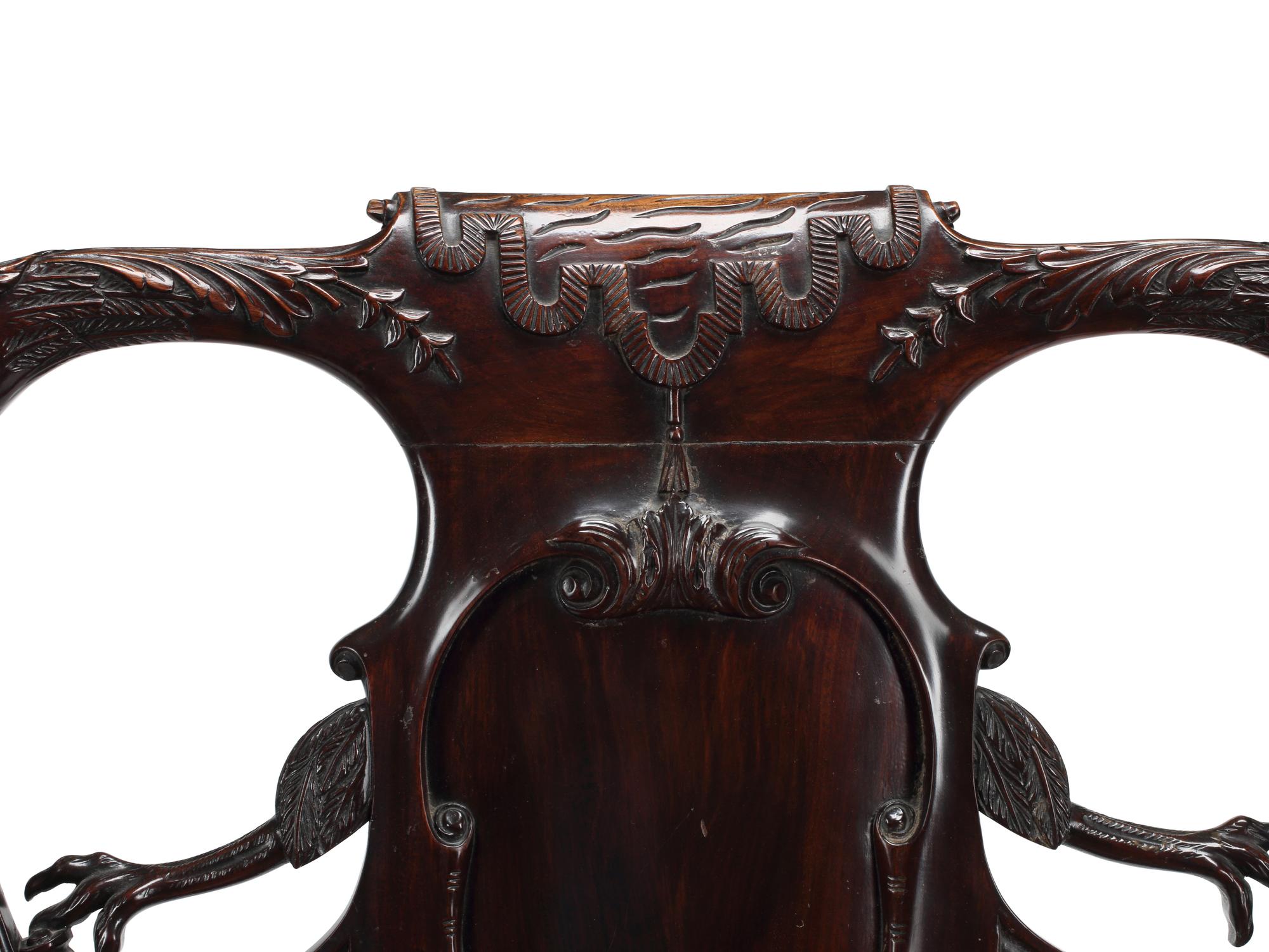 An English Carved Mahogany Leather-Upholstered Armchair