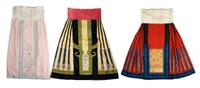 A Group of Three Chinese Silk Skirts, Length of longest 39 inches.