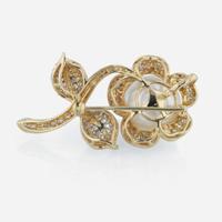 An 18K yellow gold, South Sea cultured pearl, and diamond pendant/brooch