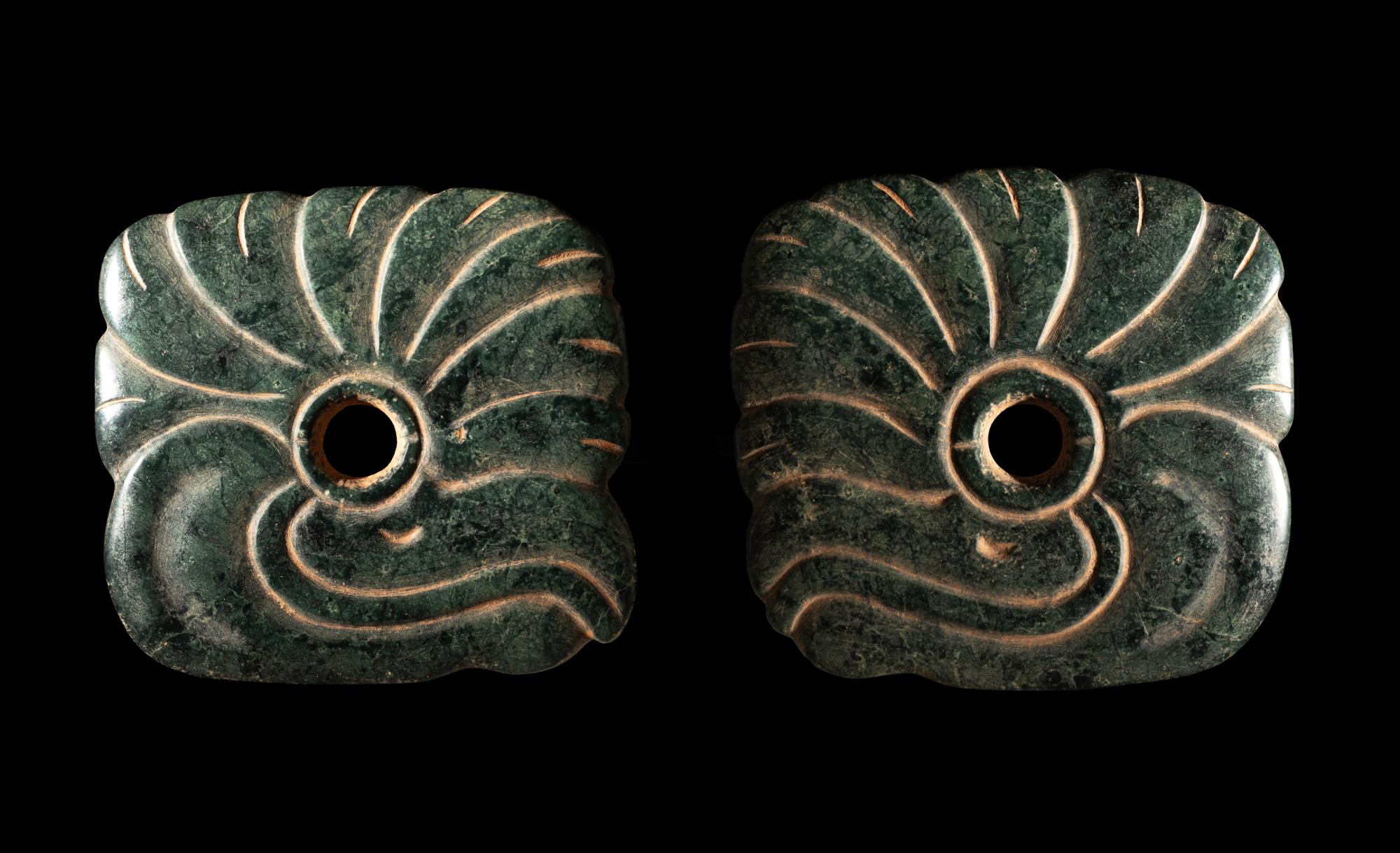 A Pair of Maya Jade Earspools in the Form of a Quetzal Bird