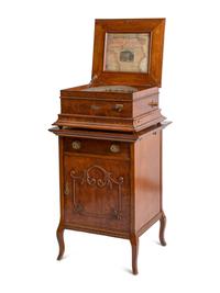 A Regina Coin Operated 15 1/2 Inch Disc Music Box and Stand