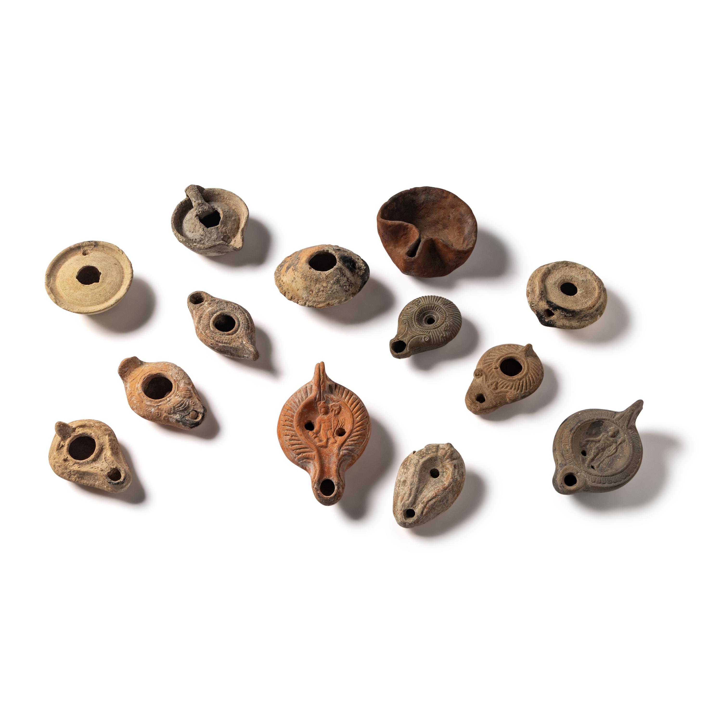 Thirteen Roman and Holy Land Terracotta Lamps