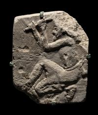 An Egyptian Limestone Relief of a Sculptor
