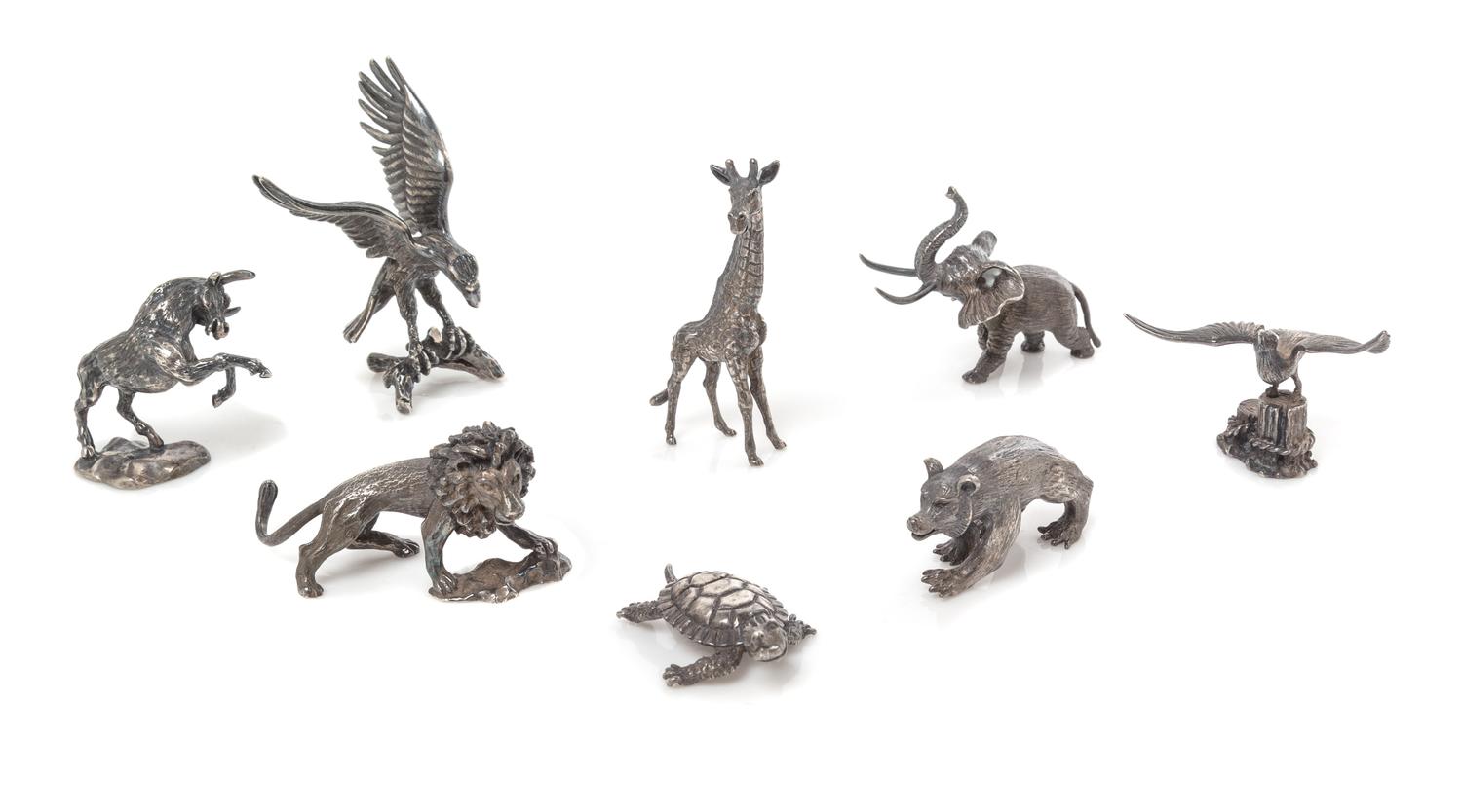 A Group of Eight French Silver Miniature Animal Figures, Cartier, Paris, 20th Century, comprising a bull, elephant, seagull, lion, bear