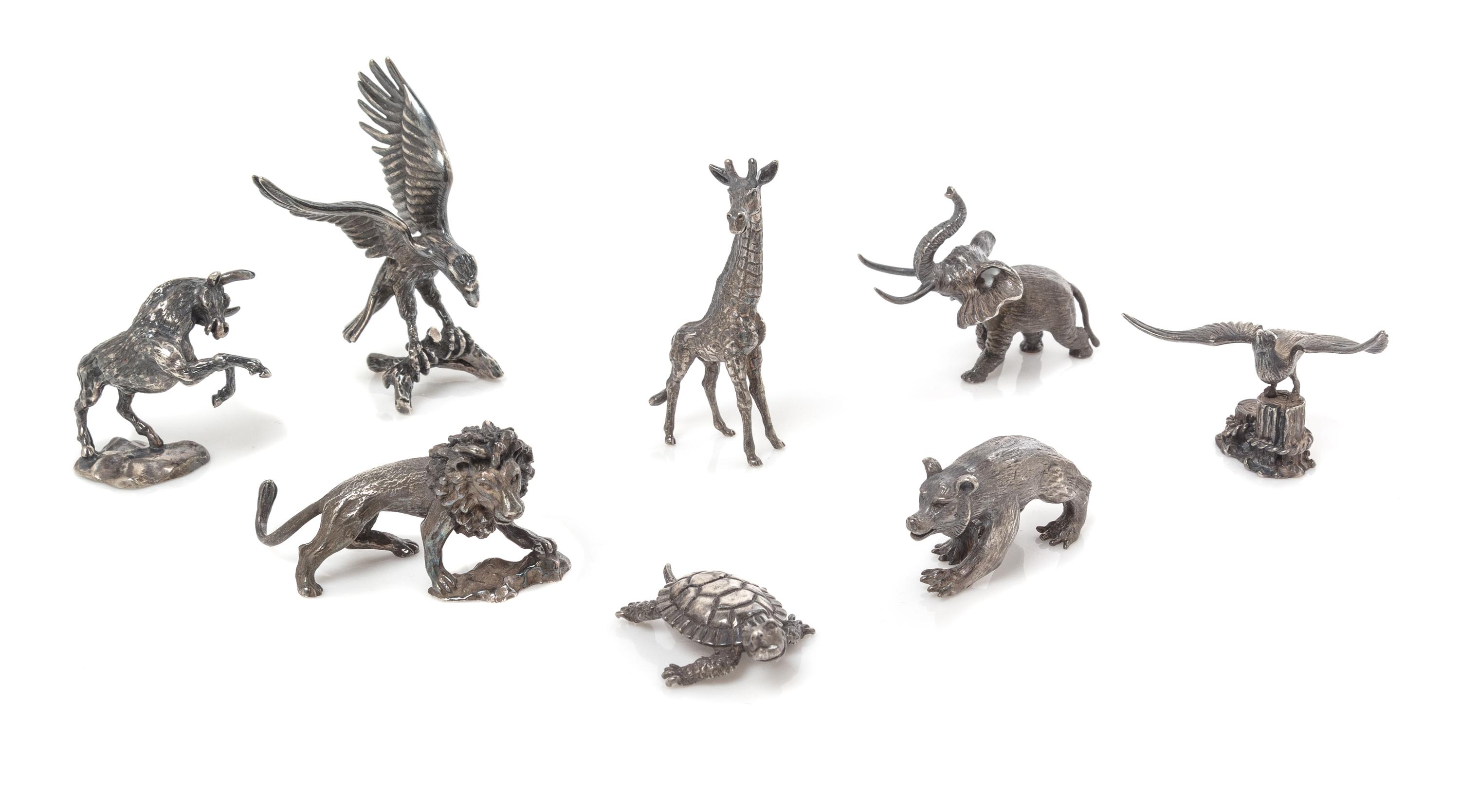 A Group of Eight French Silver Miniature Animal Figures, Cartier, Paris, 20th Century, comprising a bull, elephant, seagull, lion, bear