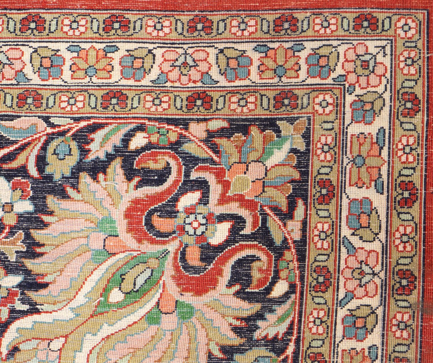 An Indo-Kashan Silk and Wool Rug