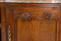 A Louis XV Provincial Carved Oak Marble-Top Console Cabinet
