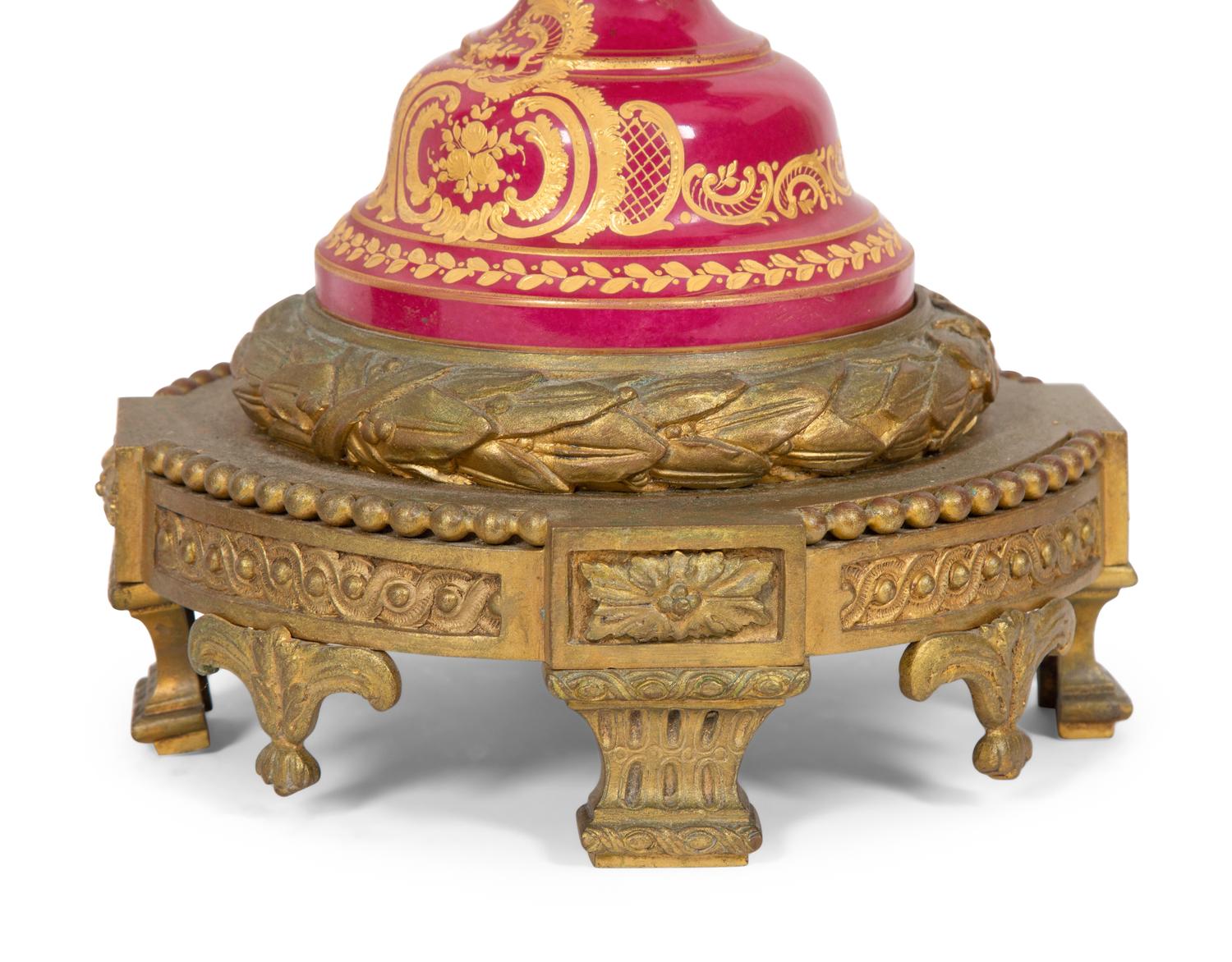 A Pair of Gilt Bronze Mounted Sevres Style Porcelain Covered Urns