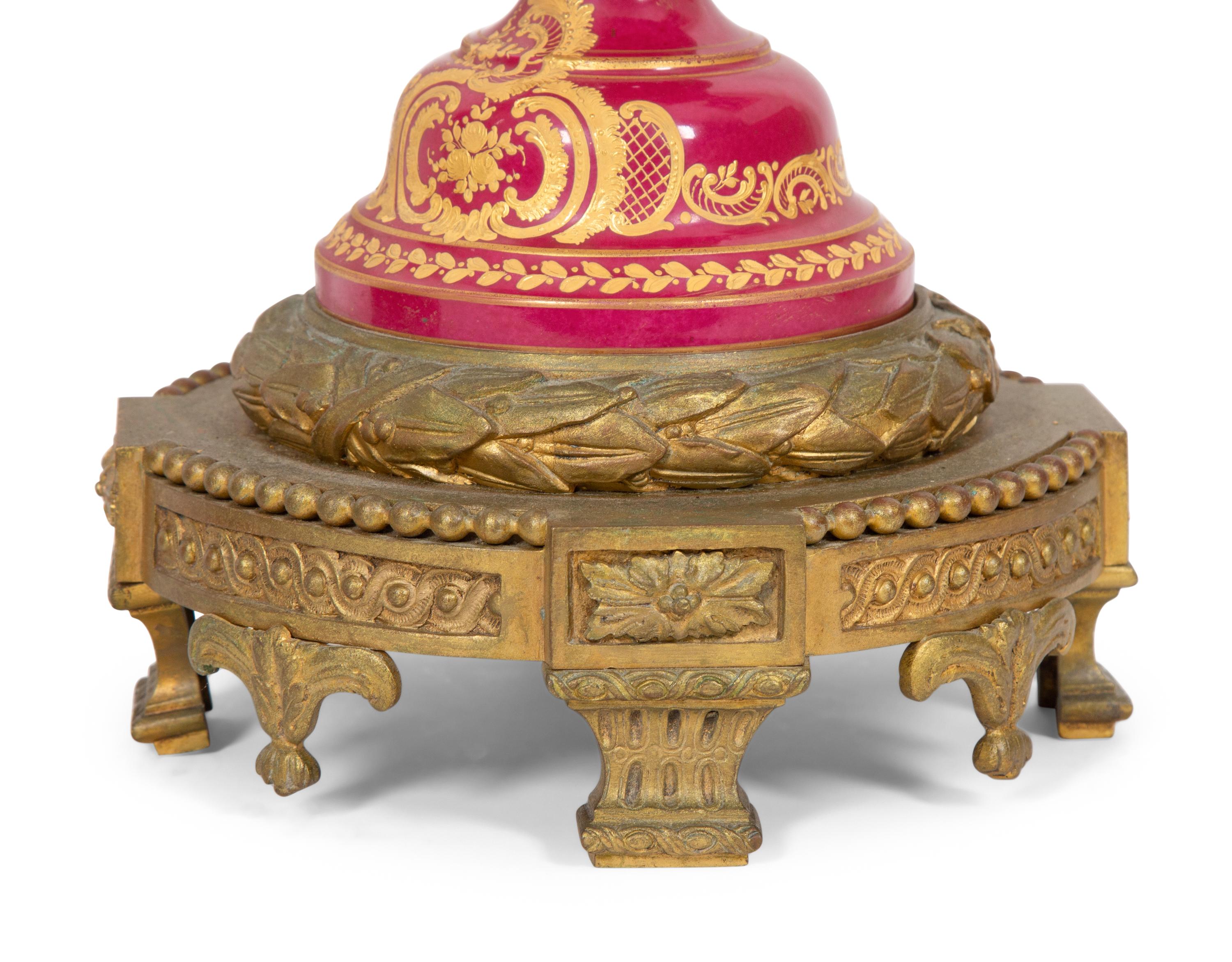 A Pair of Gilt Bronze Mounted Sevres Style Porcelain Covered Urns