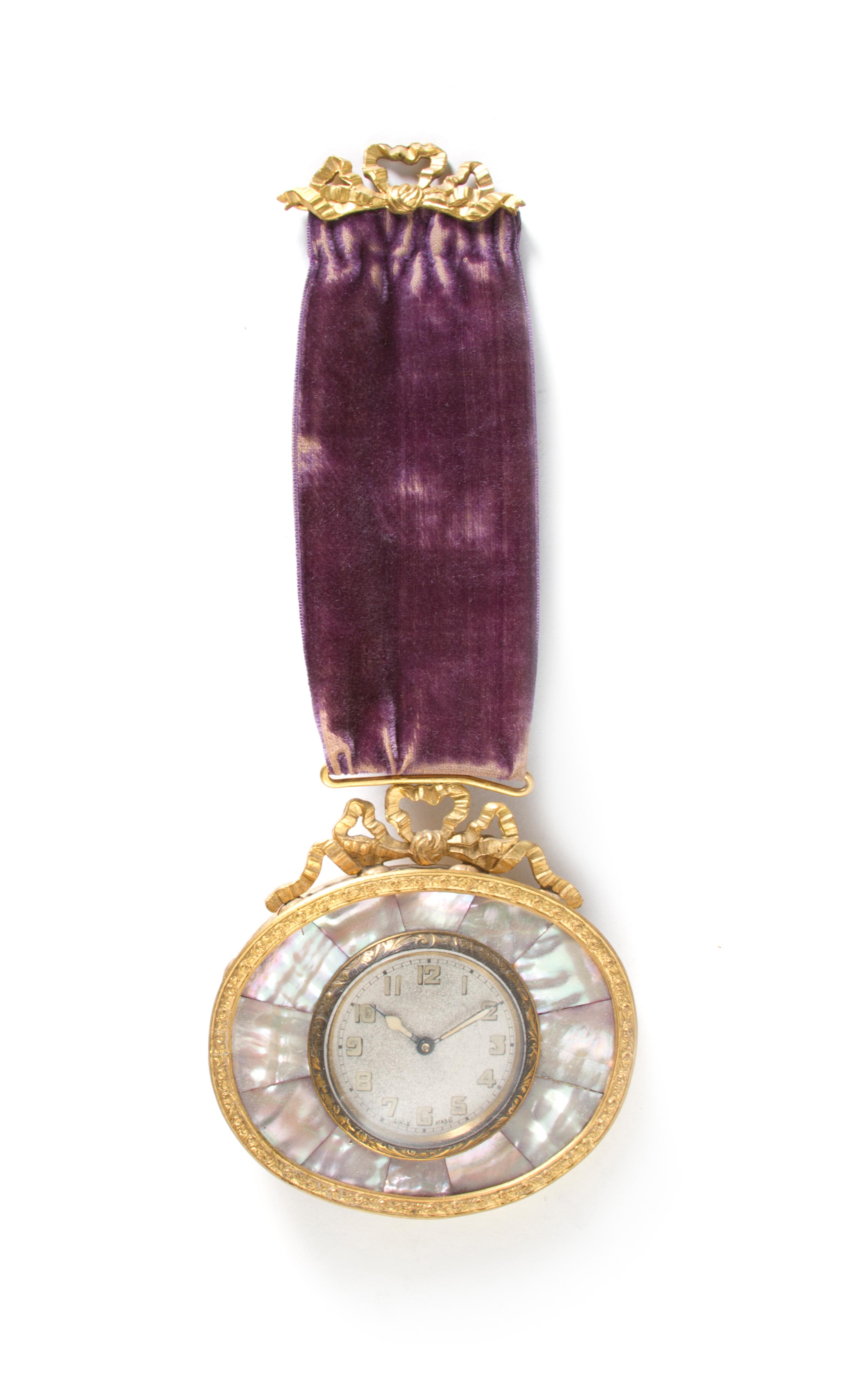 An Austrian Gilt Metal and Mother-of-Pearl Inlaid Pendant Clock, Width 3 3/4 inches.