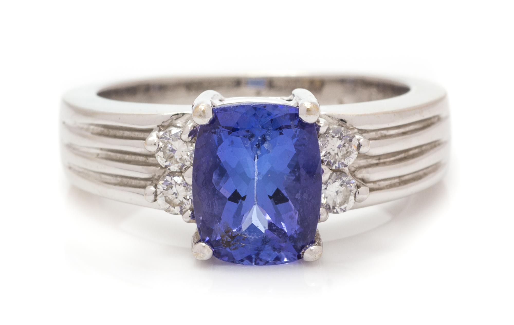 An 18 Karat White Gold, Tanzanite and Diamond Ring, 6.00 dwts.