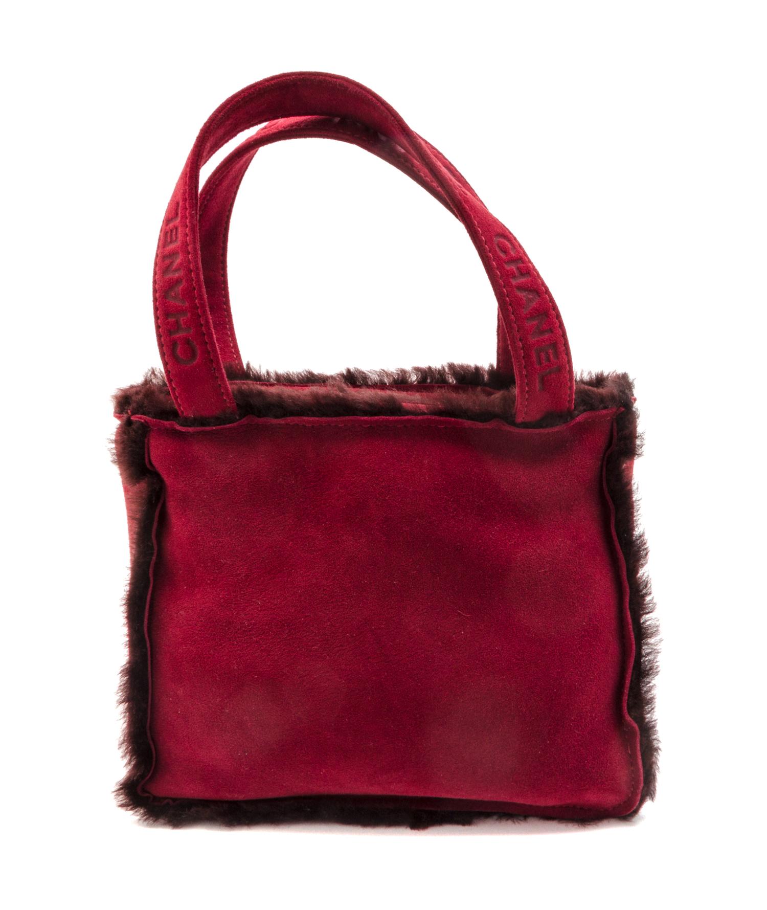 A Chanel Bordeaux Suede and Shearling Tote Bag, 9 x 8 x 3 inches.