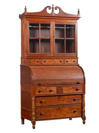 A Late Federal Cherry Wood and Tiger Maple Roll-Top Desk-and-Bookcase