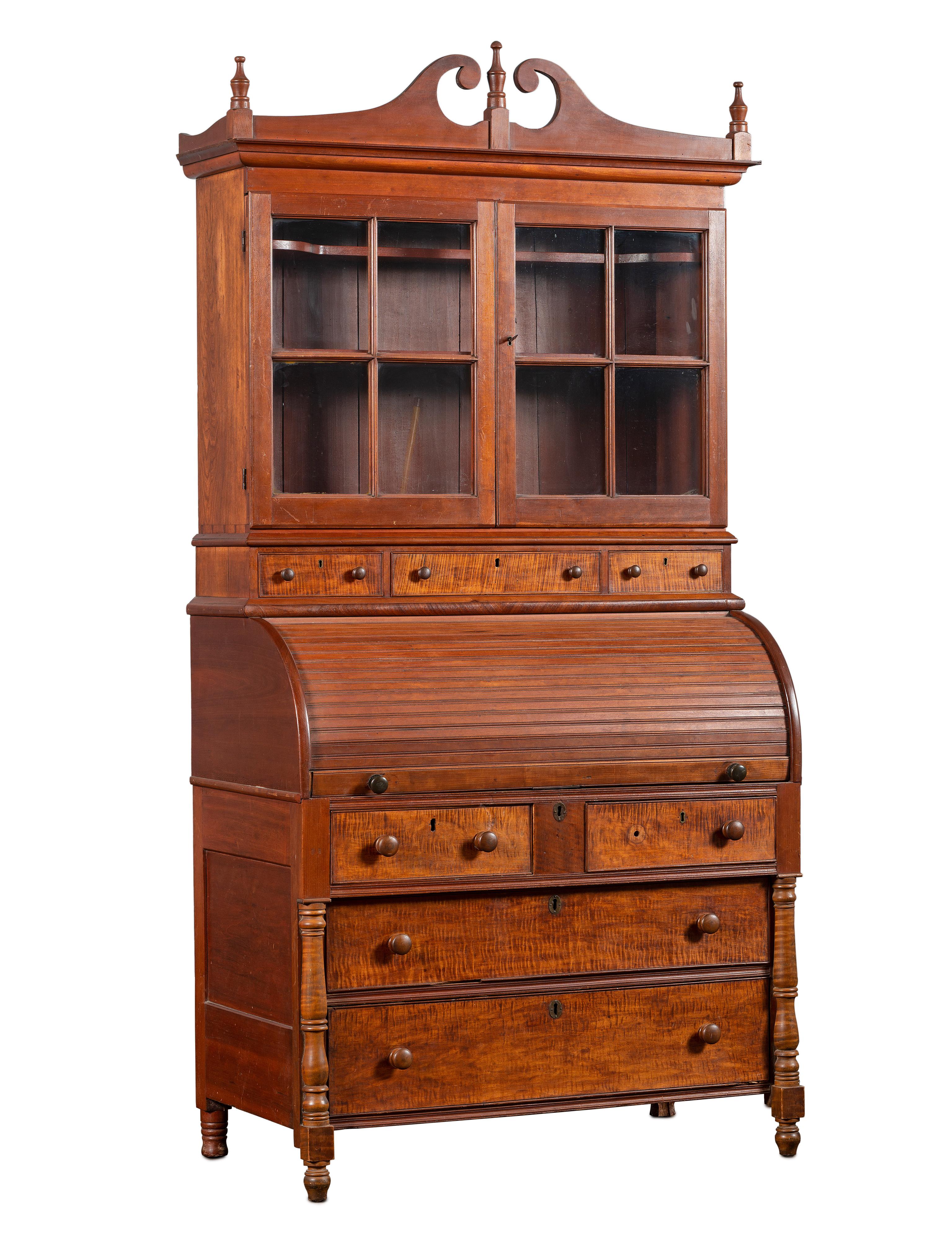 A Late Federal Cherry Wood and Tiger Maple Roll-Top Desk-and-Bookcase