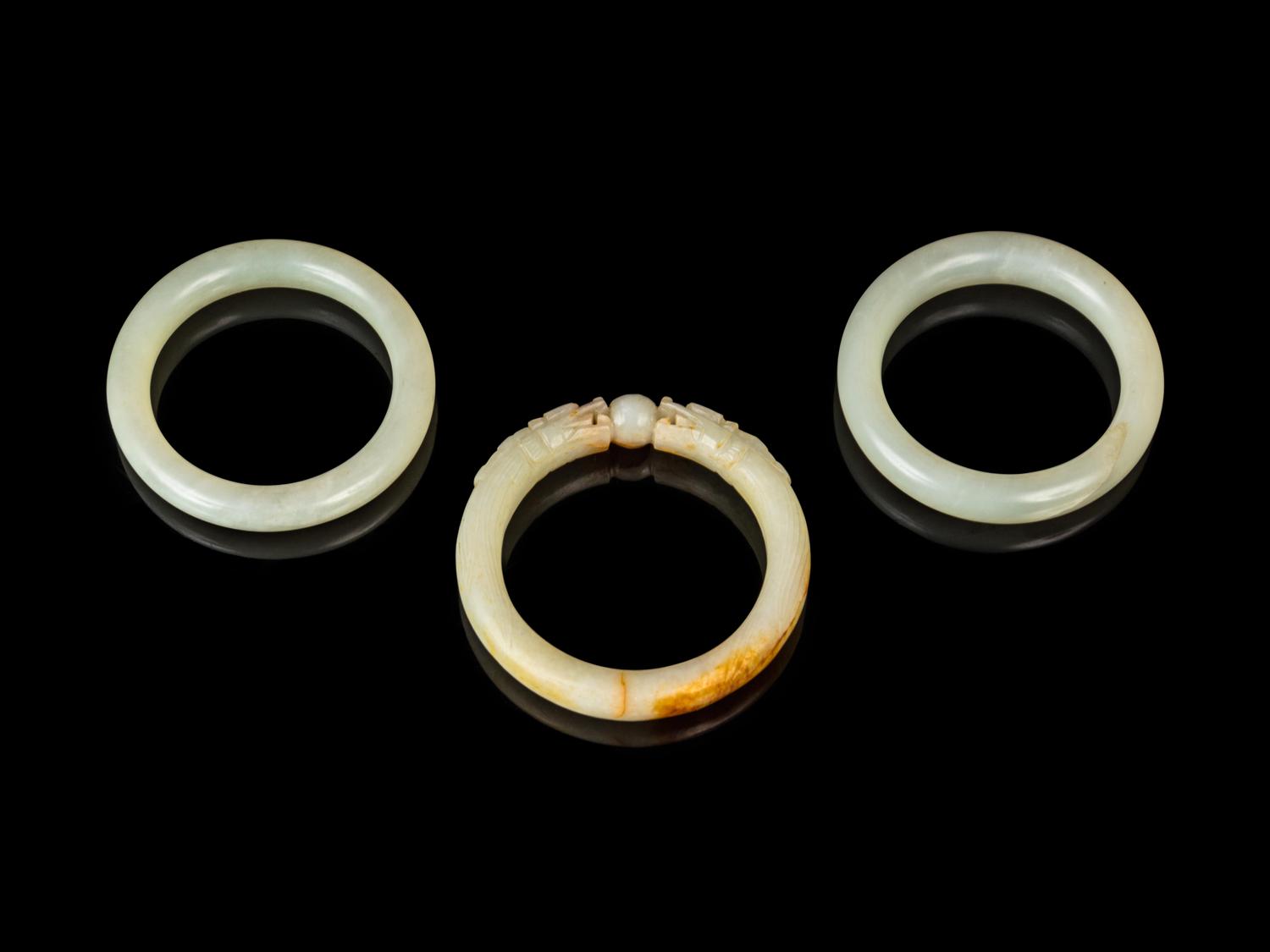 Three Chinese Jade and Hardstone Bangles