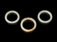 Three Chinese Jade and Hardstone Bangles