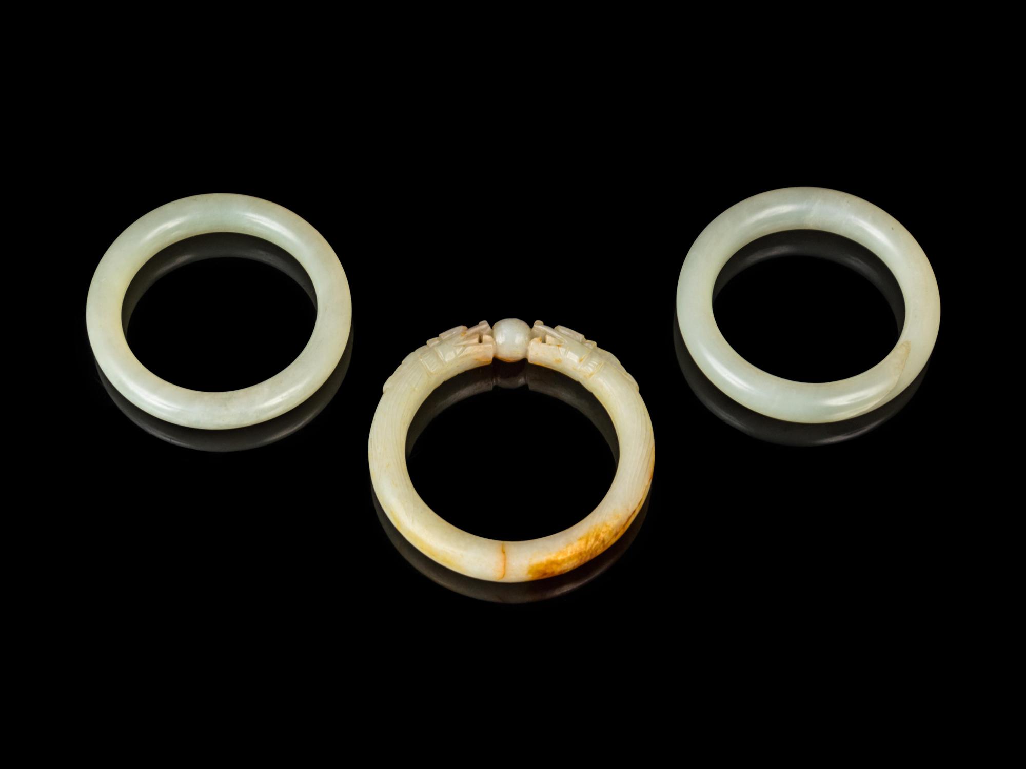 Three Chinese Jade and Hardstone Bangles