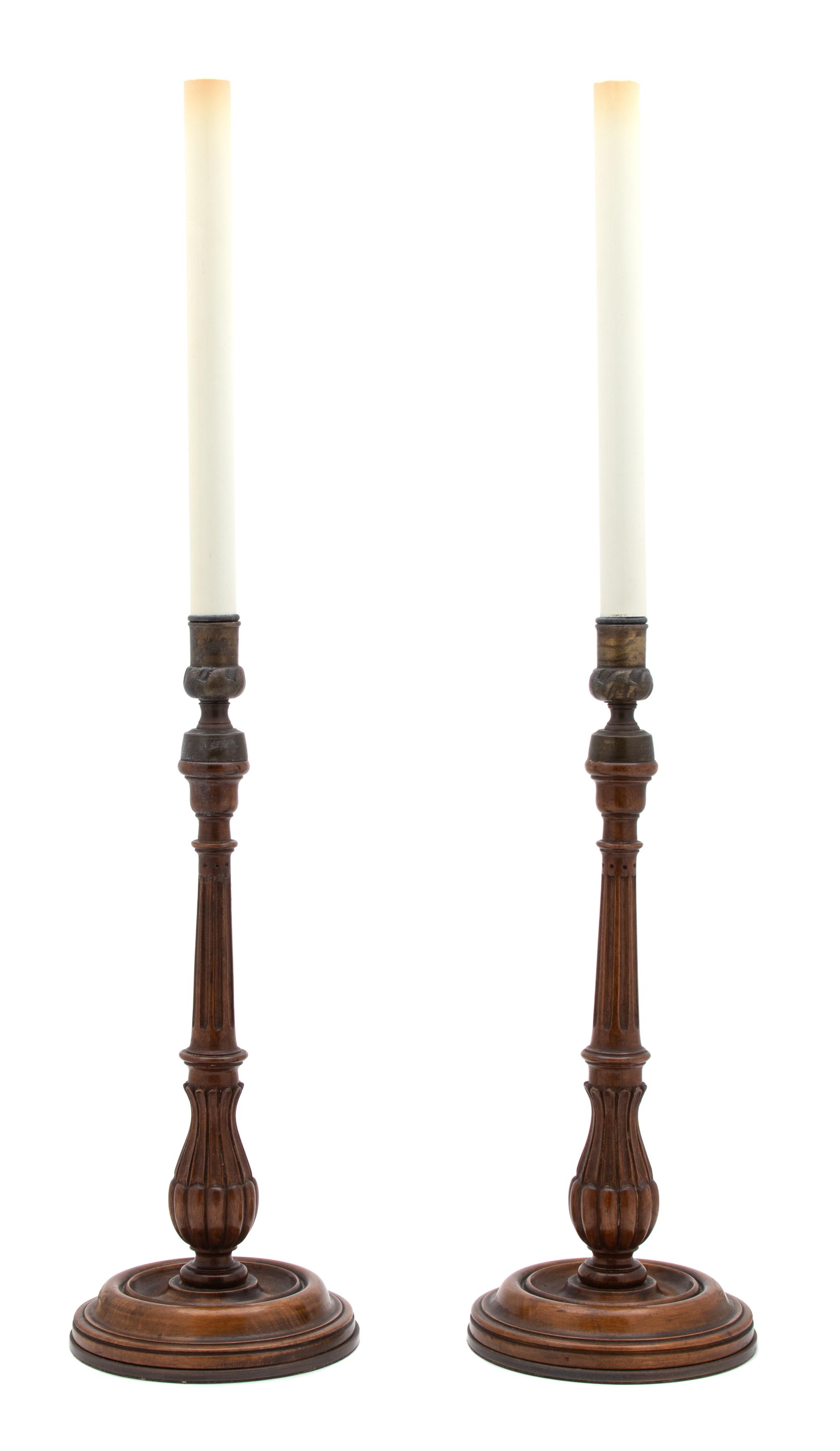 A Pair of English Walnut Columnar-Form Candlesticks Height overall 29 inches. — EARLY 20TH CENTURY