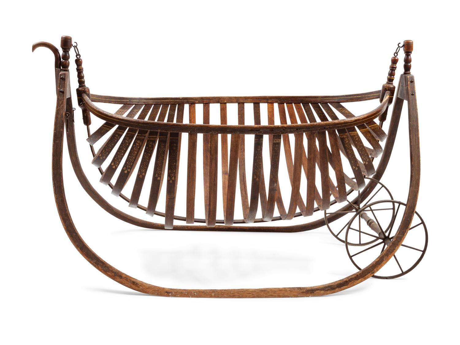 American Field Cradle With a Canoe-Shaped Slat Basket Hanging on Bentwood Holders