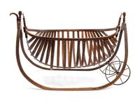 American Field Cradle With a Canoe-Shaped Slat Basket Hanging on Bentwood Holders
